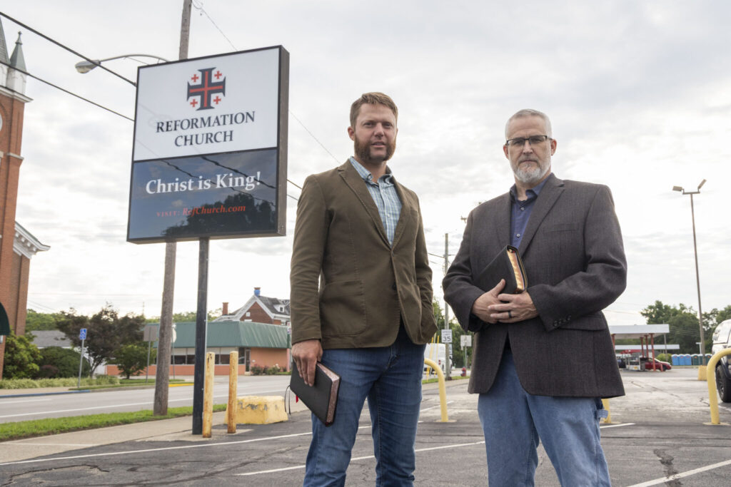 Pastors Tanner Cartwright, left, and Jerry Dorris, of the Reformation Church in Shelbyville, stand for a portrait, Aug. 5, 2025. The church has encouraged its members to check out and not return LBGTQ-related books from the public library. (Kentucky Lantern photo by David Stephenson)